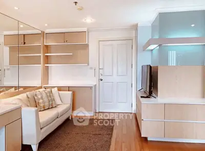 Modern living room with sleek wooden furniture and cozy sofa in a bright apartment.
