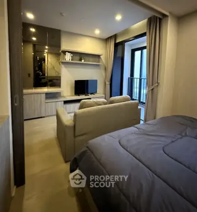 Modern studio apartment with cozy living area and stylish decor
