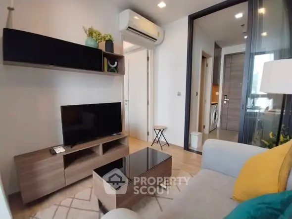 Modern living room with stylish furniture and air conditioning in a cozy apartment.