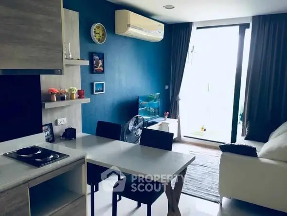 Modern living room with open kitchen and large window view