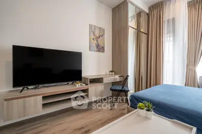 Modern bedroom with sleek TV setup and stylish decor