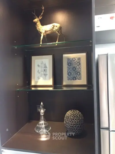 Modern kitchen interior with stylish decor and stainless steel fridge