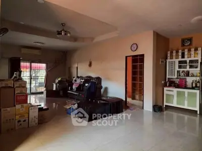 Spacious living room with modern decor and ample natural light