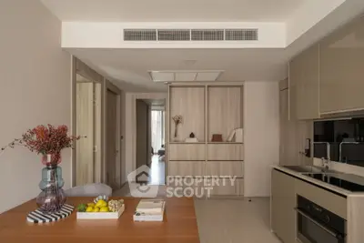 Modern kitchen with sleek cabinetry and integrated appliances in a stylish apartment.