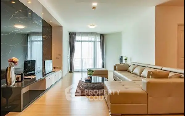 Spacious modern living room with elegant decor and large sectional sofa