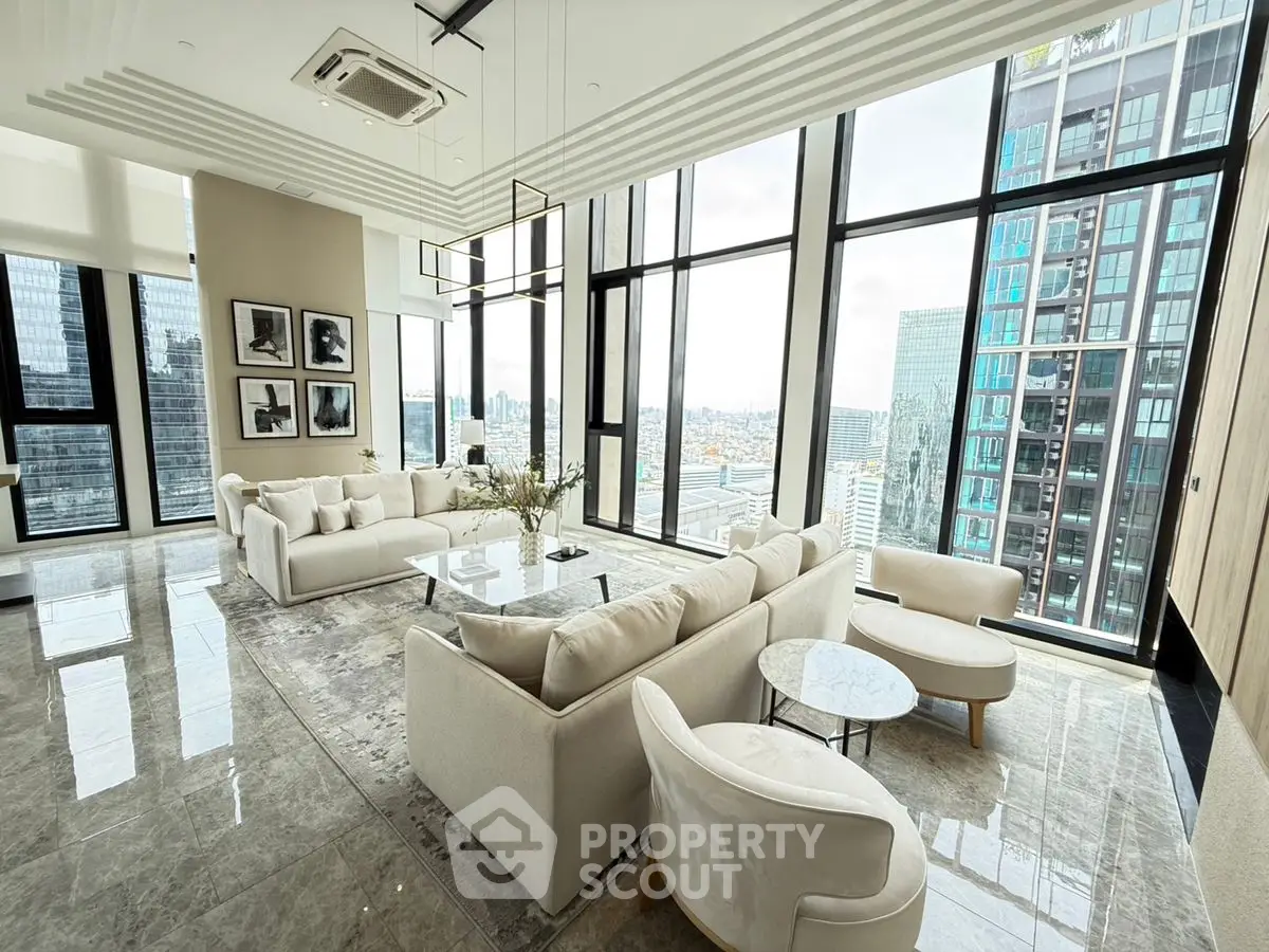 Luxurious high-rise living room with panoramic city views and elegant modern furnishings.