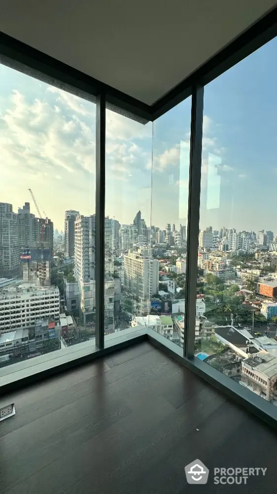 Stunning corner unit with panoramic city view from floor-to-ceiling windows