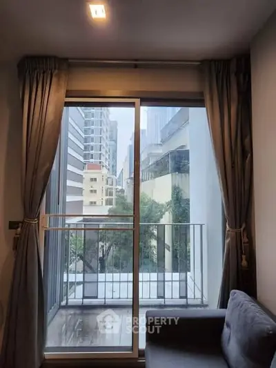 Modern apartment living room with balcony and city view