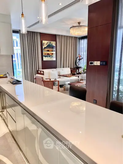 Luxurious modern living room with elegant decor and open kitchen layout