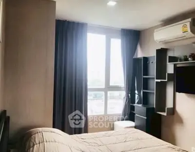 Cozy bedroom with large window and modern air conditioning unit