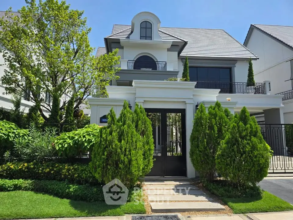 Elegant three-story house with lush greenery and modern architecture