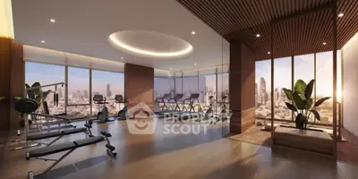 Luxurious gym with panoramic city views and modern fitness equipment in high-rise building.