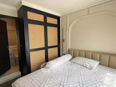 Modern bedroom with stylish wardrobe and cozy bed in a contemporary apartment.