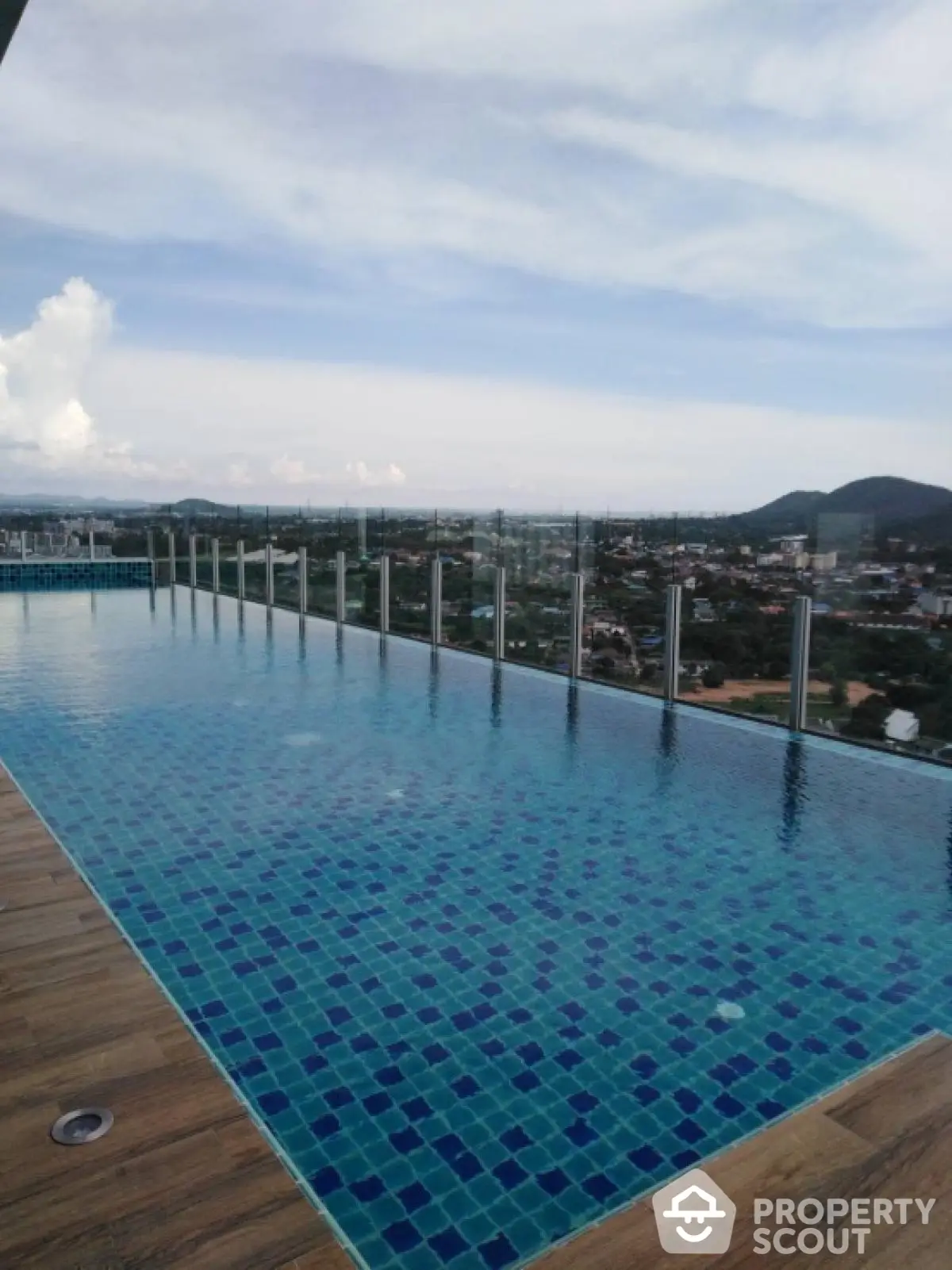 Stunning rooftop infinity pool with panoramic city and mountain views