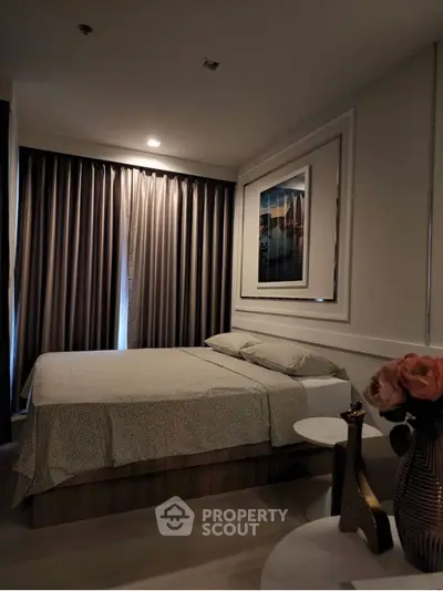 Cozy bedroom with elegant decor and soft lighting, perfect for relaxation and comfort.