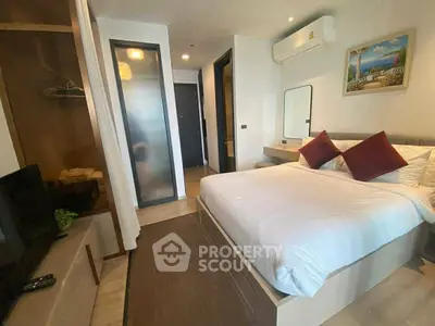 Modern bedroom with cozy decor and air conditioning in a stylish apartment.