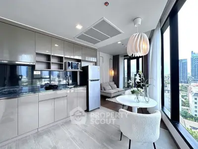Modern open-layout kitchen and living area with city view