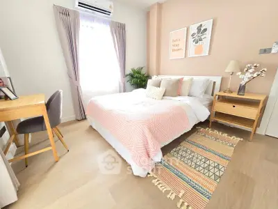 Cozy bedroom with stylish decor and natural light