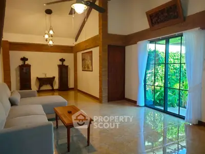Spacious living room with elegant decor and garden view