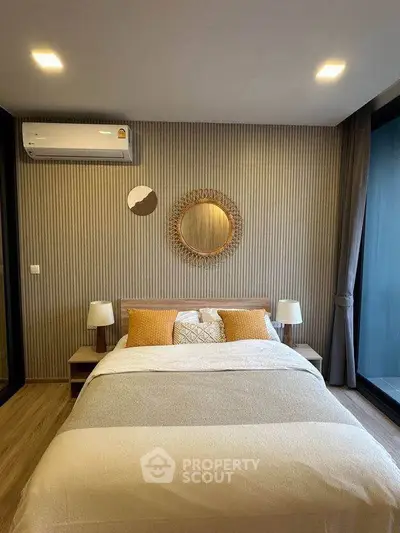 Modern bedroom with stylish decor and cozy ambiance, featuring a comfortable bed and elegant lighting.