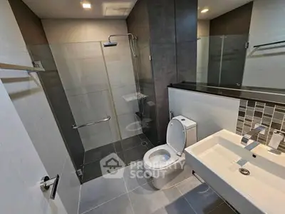 Modern bathroom with glass shower and sleek fixtures