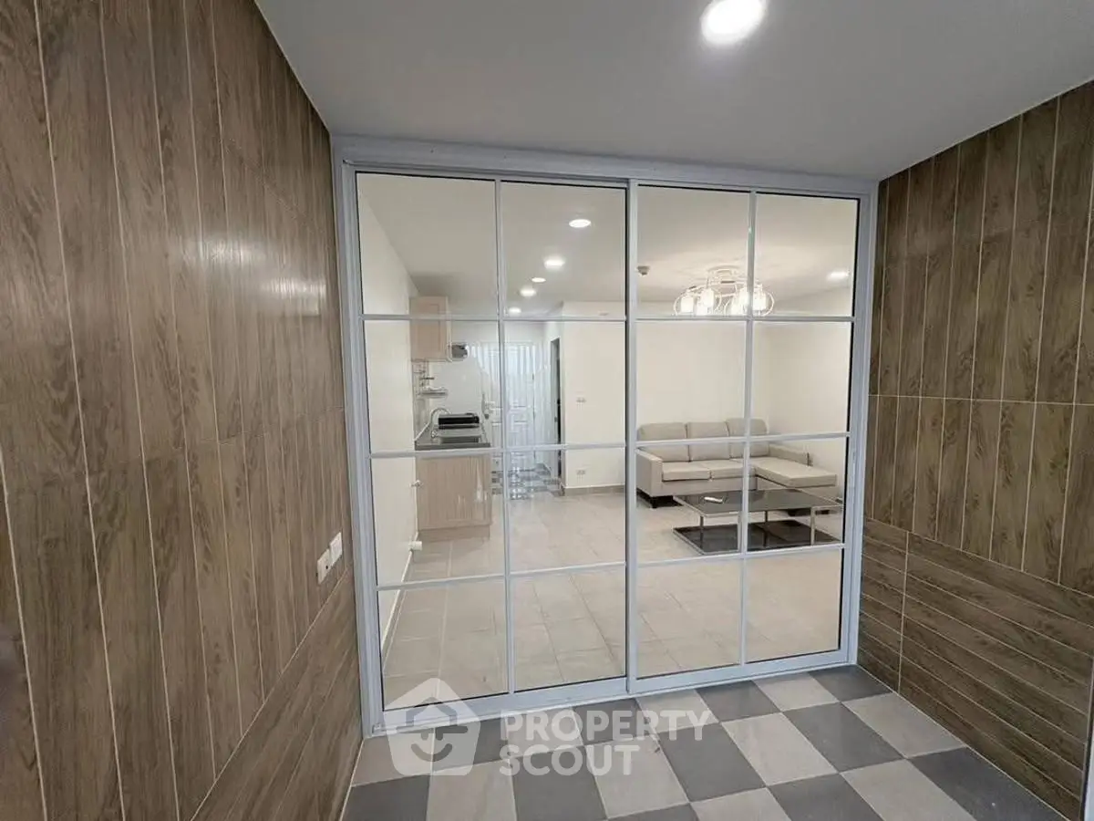 Modern interior with glass partition and stylish living room