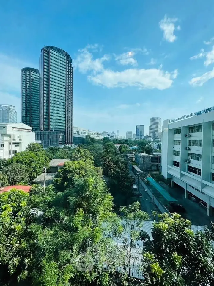 Stunning cityscape view with modern high-rise buildings and lush greenery