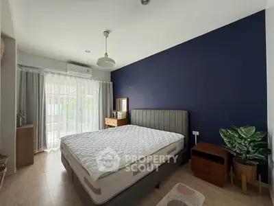 Modern bedroom with stylish decor and natural light