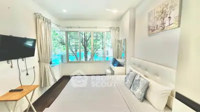 Bright and airy bedroom with large windows and modern decor
