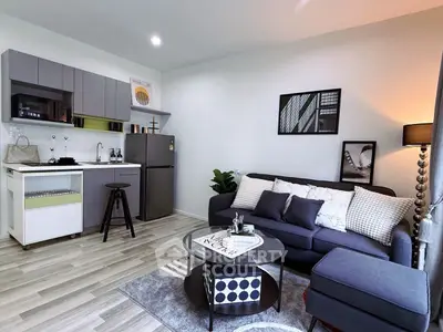 Modern living room with stylish kitchen and cozy seating area
