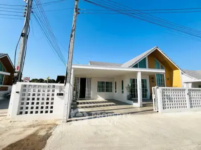 Charming modern house with spacious driveway and unique architectural design.