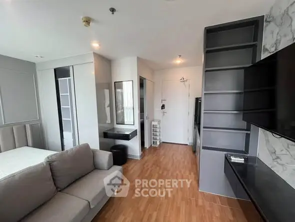Modern living room with sleek design and stylish furniture in a contemporary apartment.