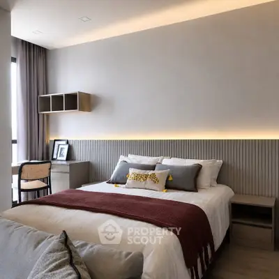 Modern bedroom with stylish decor and ambient lighting, featuring a cozy bed and elegant furnishings.