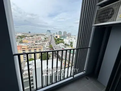 Stunning city view from a modern high-rise balcony, perfect for urban living.