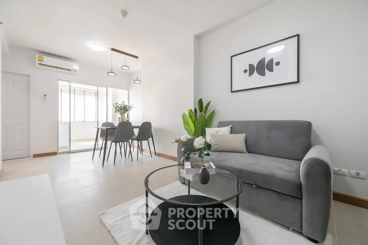 Modern living room with stylish decor and open dining area