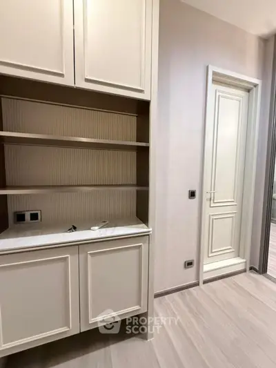 Elegant interior with built-in storage and modern door in a stylish apartment