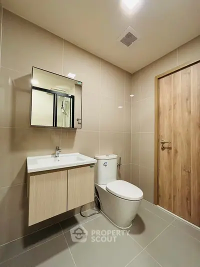Modern bathroom with sleek fixtures and neutral tones