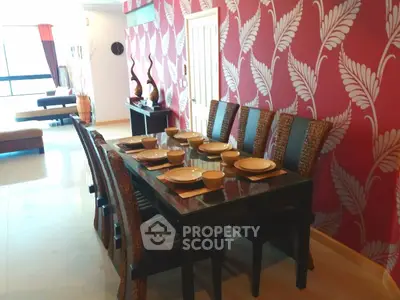 Elegant dining area with stylish decor and modern furniture in a spacious living room.