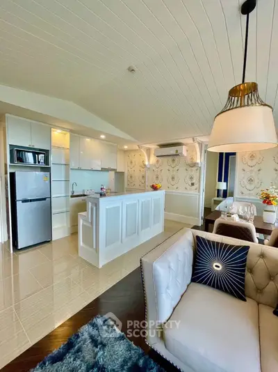 Luxurious open-plan living room with modern kitchen and elegant decor