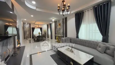 Luxurious living room with elegant chandelier and modern decor
