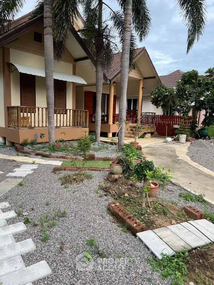 Charming suburban home with lush garden and inviting porch