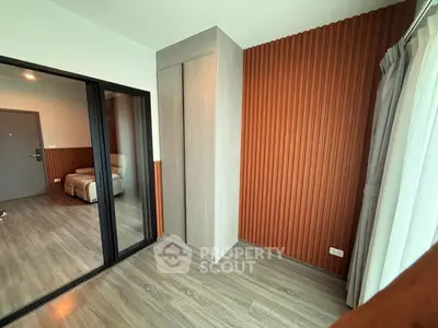Modern interior with wood paneling and sliding glass doors