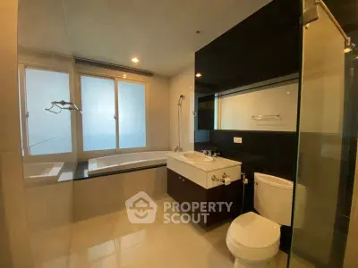 Luxurious bathroom with modern fixtures and large bathtub in a high-end apartment.