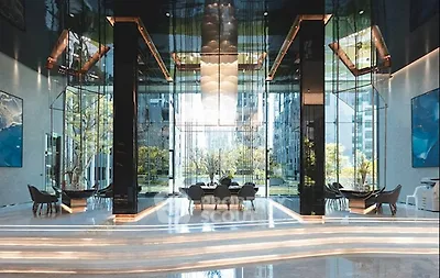 Luxurious modern building lobby with high ceilings and elegant decor