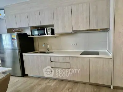 Modern kitchen with sleek cabinetry and stainless steel appliances