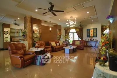 Luxurious and spacious living room with elegant decor and comfortable seating, perfect for relaxation and entertainment.