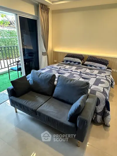 Cozy bedroom with modern decor and balcony access