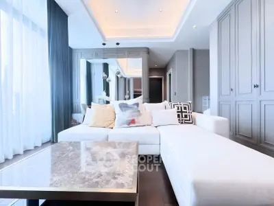 Luxurious modern living room with elegant decor and spacious seating area.