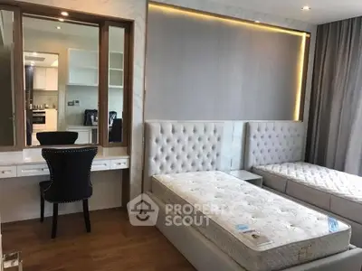 Modern bedroom with twin beds and elegant vanity in luxury apartment