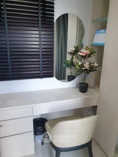 Modern study nook with elegant desk, chair, and decorative plants